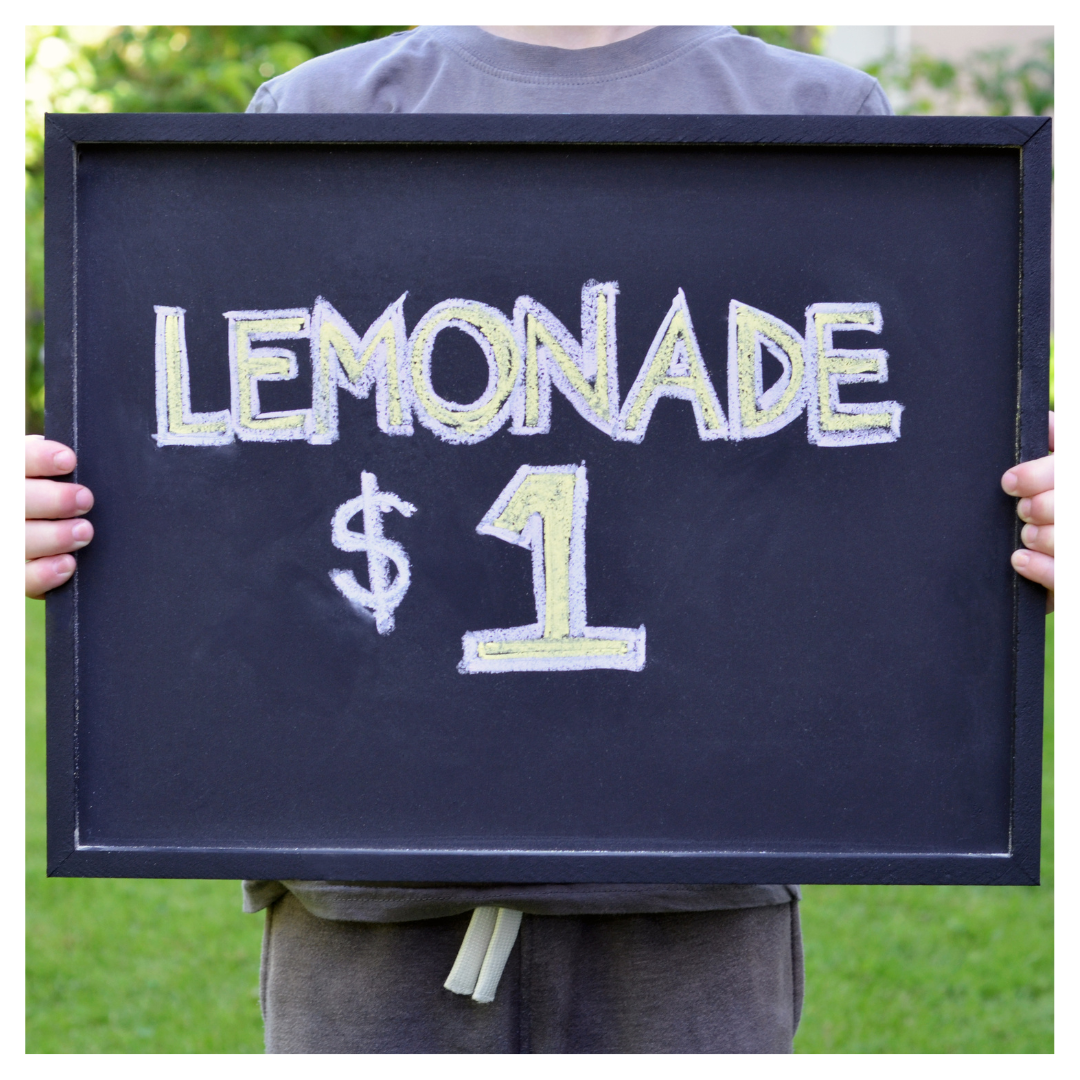 Picture of a sign advertising lemonade for $1.